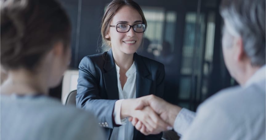 Two business professionals shaking hands